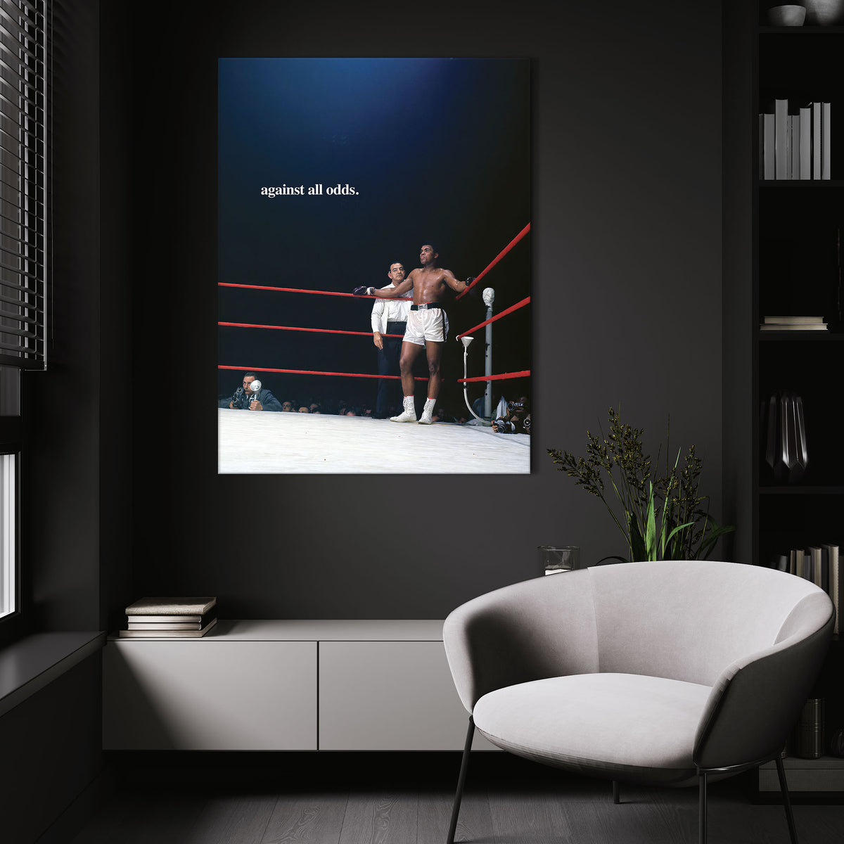 Against All Odds wall art above a white chair in a dark room