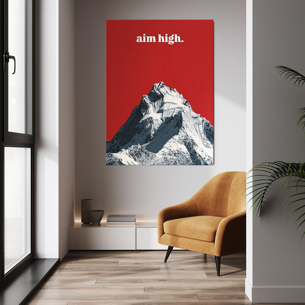 Aim High wall art above a mustard chair in a bright room