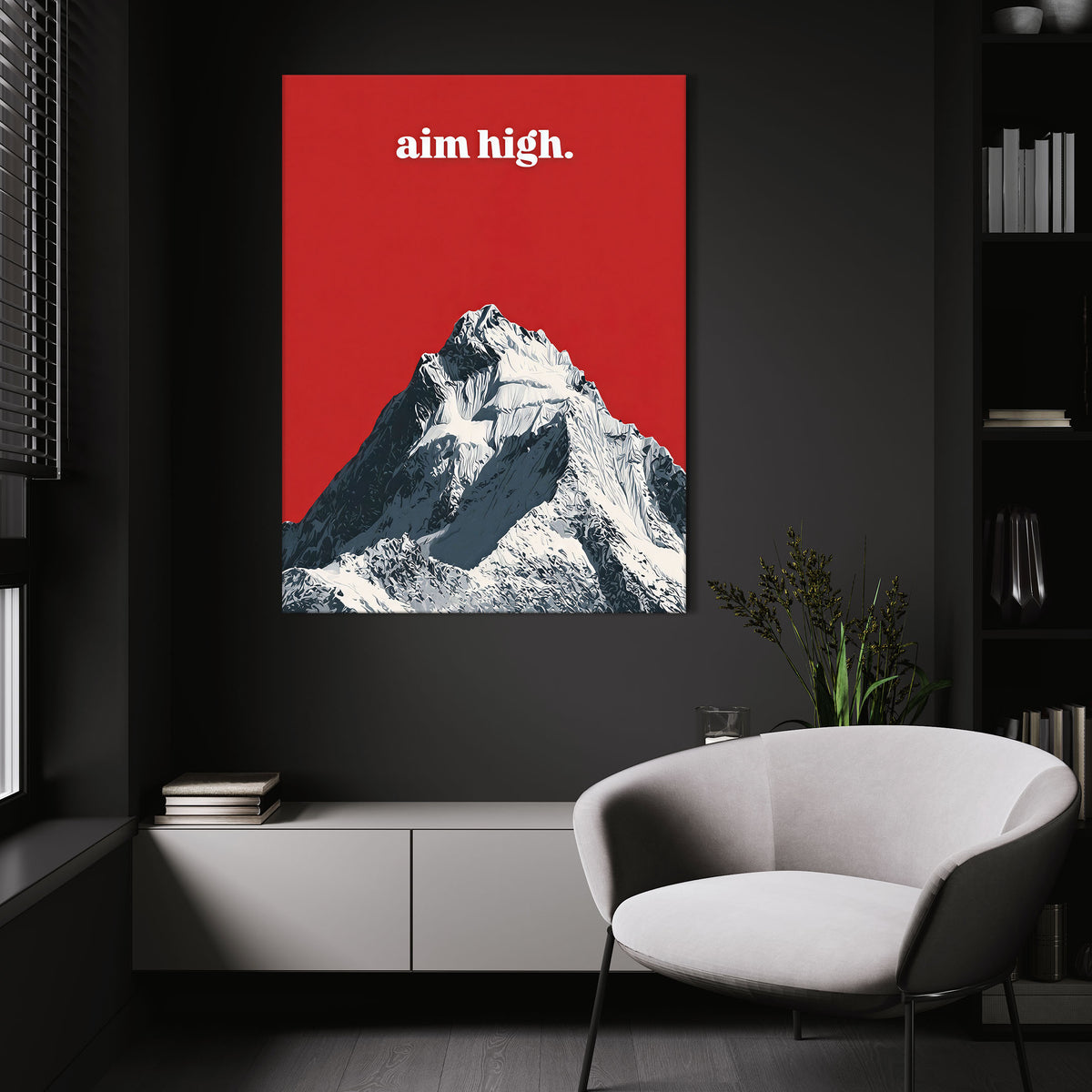 Aim High wall art above a white chair in a dark room