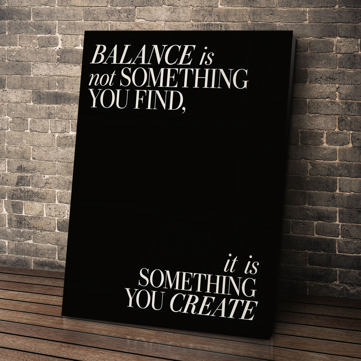 Balance quote wall art leaning against a brick wall
