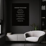 Choose Your Hard wall art above a white chair in a dark room