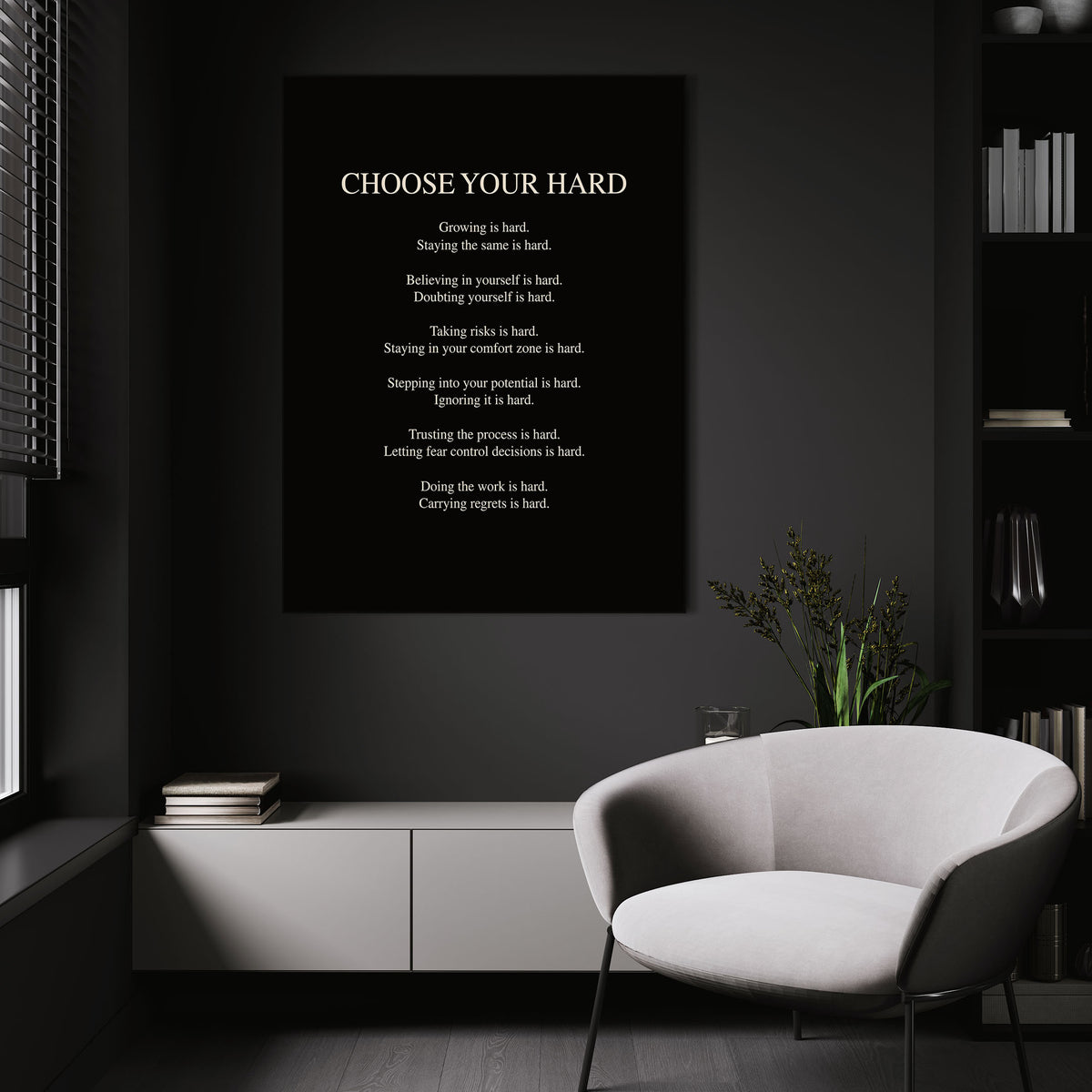 Choose Your Hard wall art above a white chair in a dark room