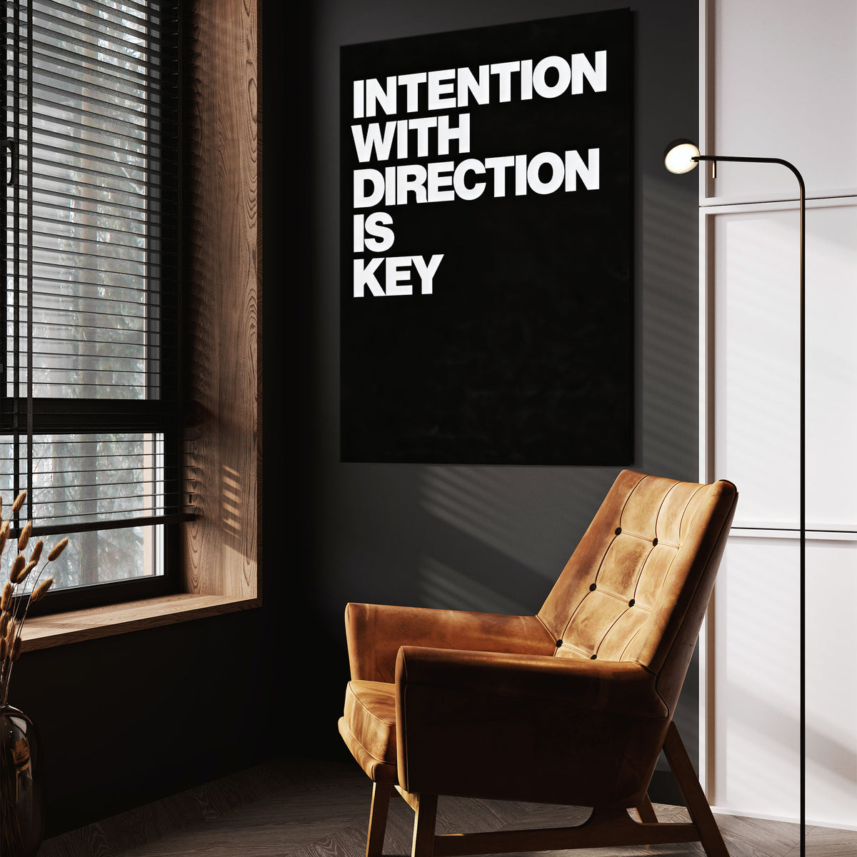 Direction Is Key wall art above a tan chair in a dark reading corner