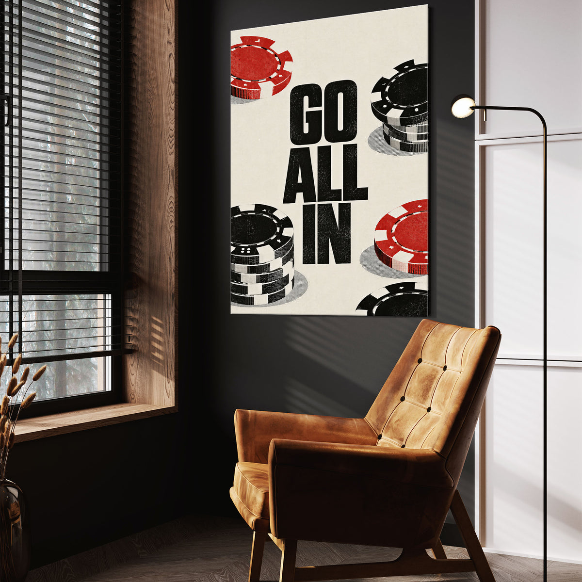 Go All In wall art above a tan chair in a dark reading corner