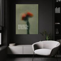 Growth Takes Time wall art above a white chair in a dark room