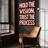 Hold the Vision wall art above a wooden lounge chair in a dark room