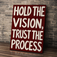 Hold the Vision wall art leaning against a brick wall