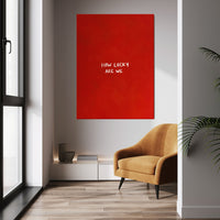 How Lucky Are We wall art above a tan chair in a bright room