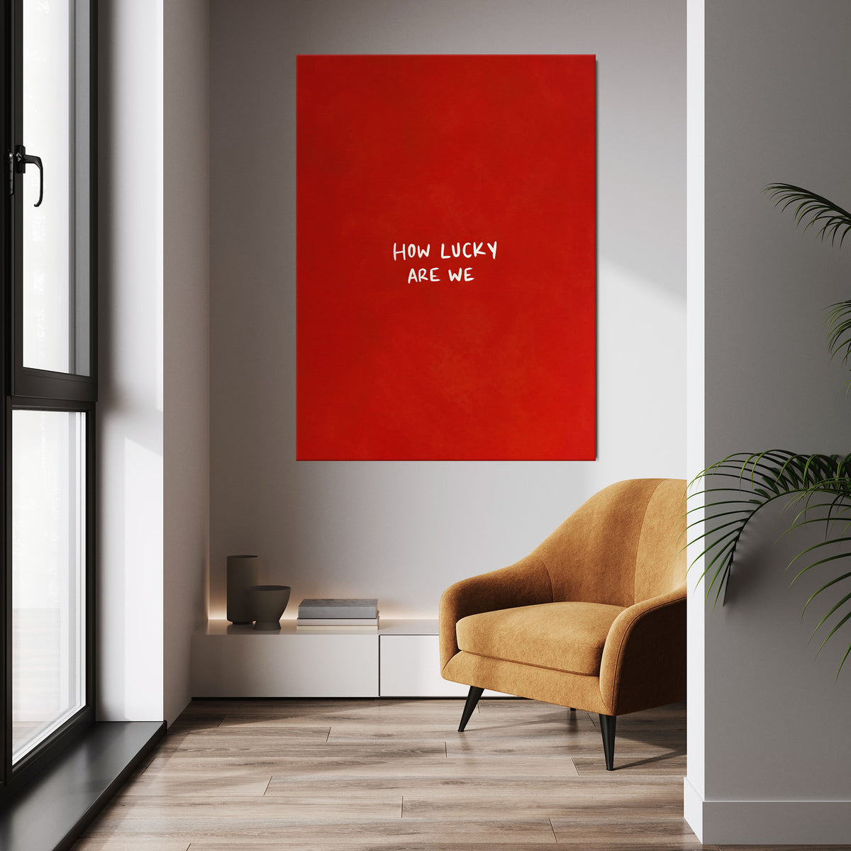 How Lucky Are We wall art above a tan chair in a bright room