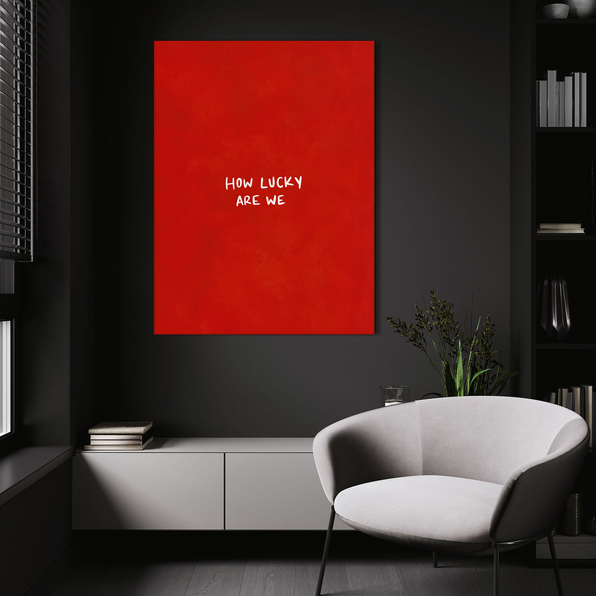 How Lucky Are We wall art above a white chair in a dark room