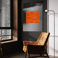Keep Moving Forward wall art above a wooden lounge chair in a dark room