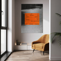 Keep Moving Forward wall art above a tan chair in a bright room