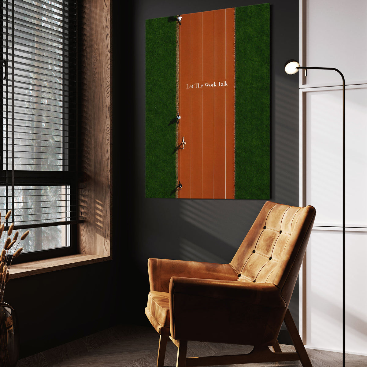 Let The Work Talk wall art above a tan chair in a dark reading corner