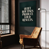 Loud Results wall art above a tan chair in a dark reading corner