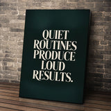 Loud Results wall art leaning against a brick wall