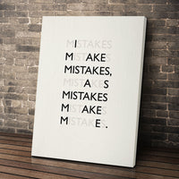 Mistakes wall art leaning against a brick wall