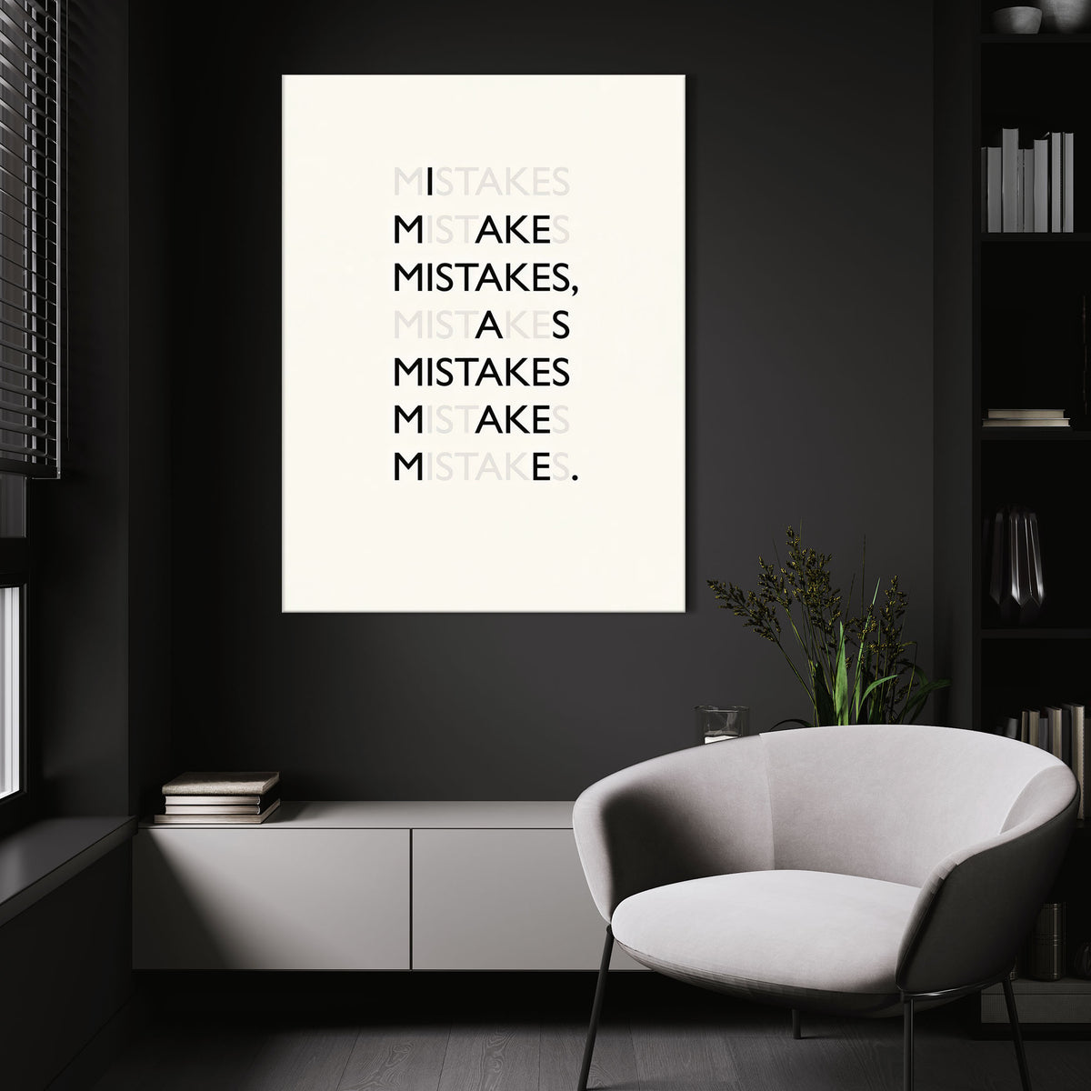 Mistakes wall art above a white chair in a dark room