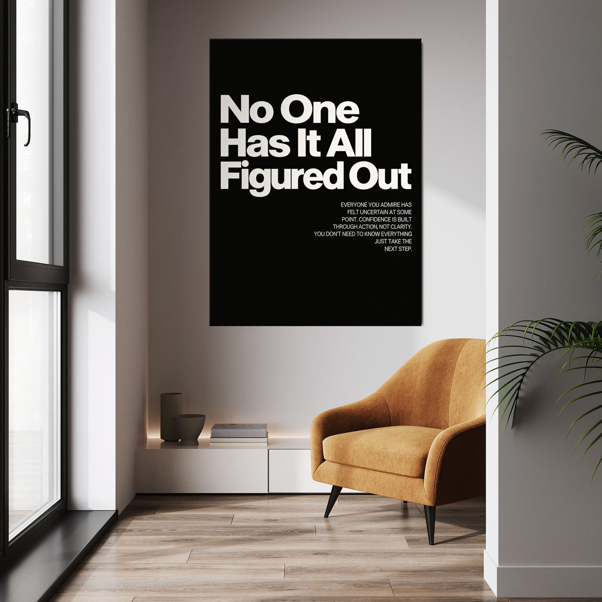 No One Has It All Figured Out wall art above a mustard chair in a bright room