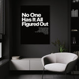 No One Has It All Figured Out wall art above a white chair in a dark room