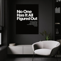 No One Has It All Figured Out wall art above a white chair in a dark room