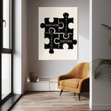 Puzzle Pieces wall art above a mustard chair in a bright room