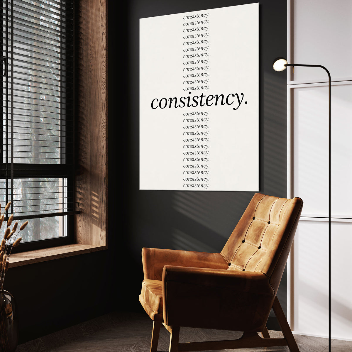Show Up Daily wall art above a wooden lounge chair in a dark room