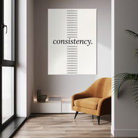 Show Up Daily wall art above a tan chair in a bright room