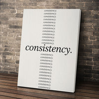 Show Up Daily wall art leaning against a brick wall