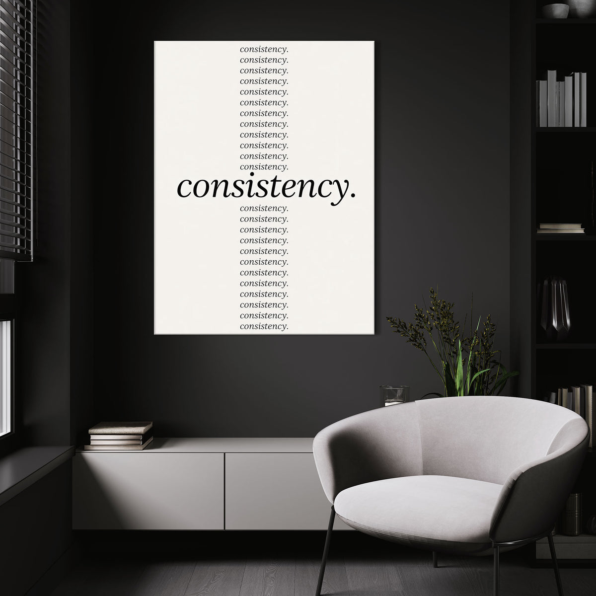Show Up Daily wall art above a white chair in a dark room