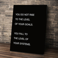Systems > Goals wall art leaning against a brick wall