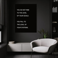 Systems > Goals wall art above a white chair in a dark room