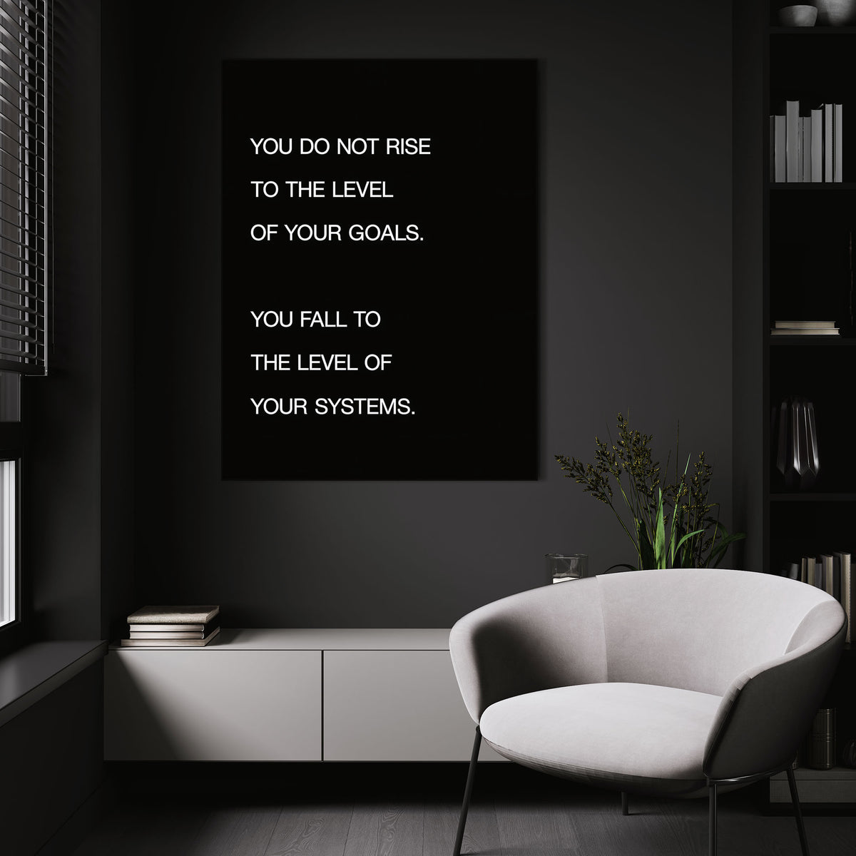 Systems > Goals wall art above a white chair in a dark room