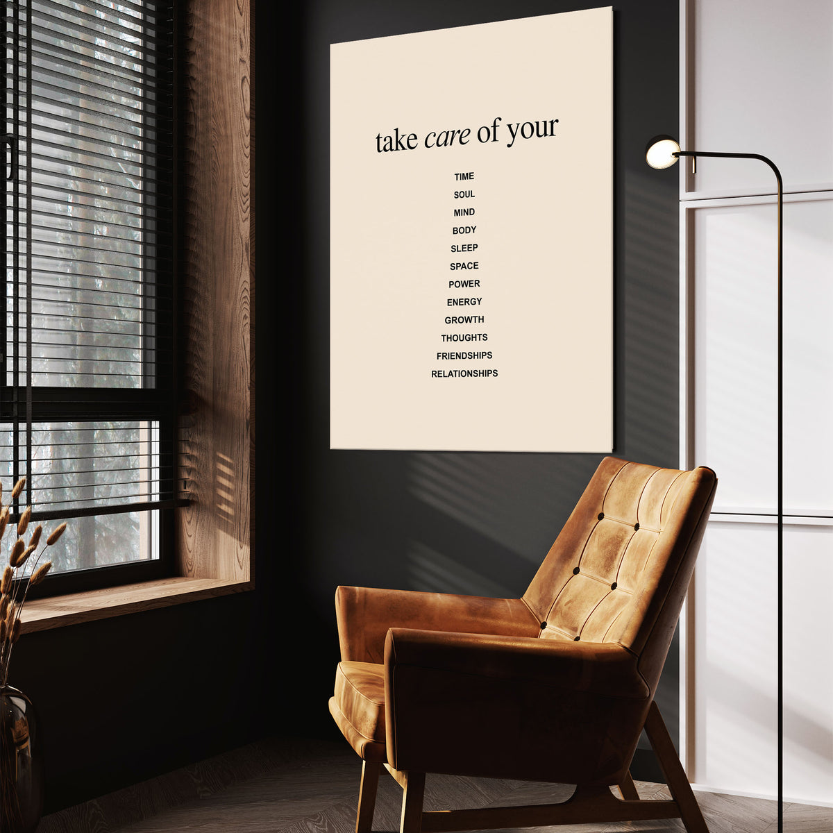 Take Care wall art above a wooden lounge chair in a dark room