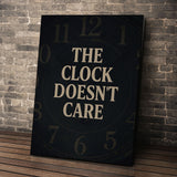 The Clock Doesn't Care wall art leaning against a brick wall