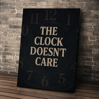 The Clock Doesn't Care wall art leaning against a brick wall