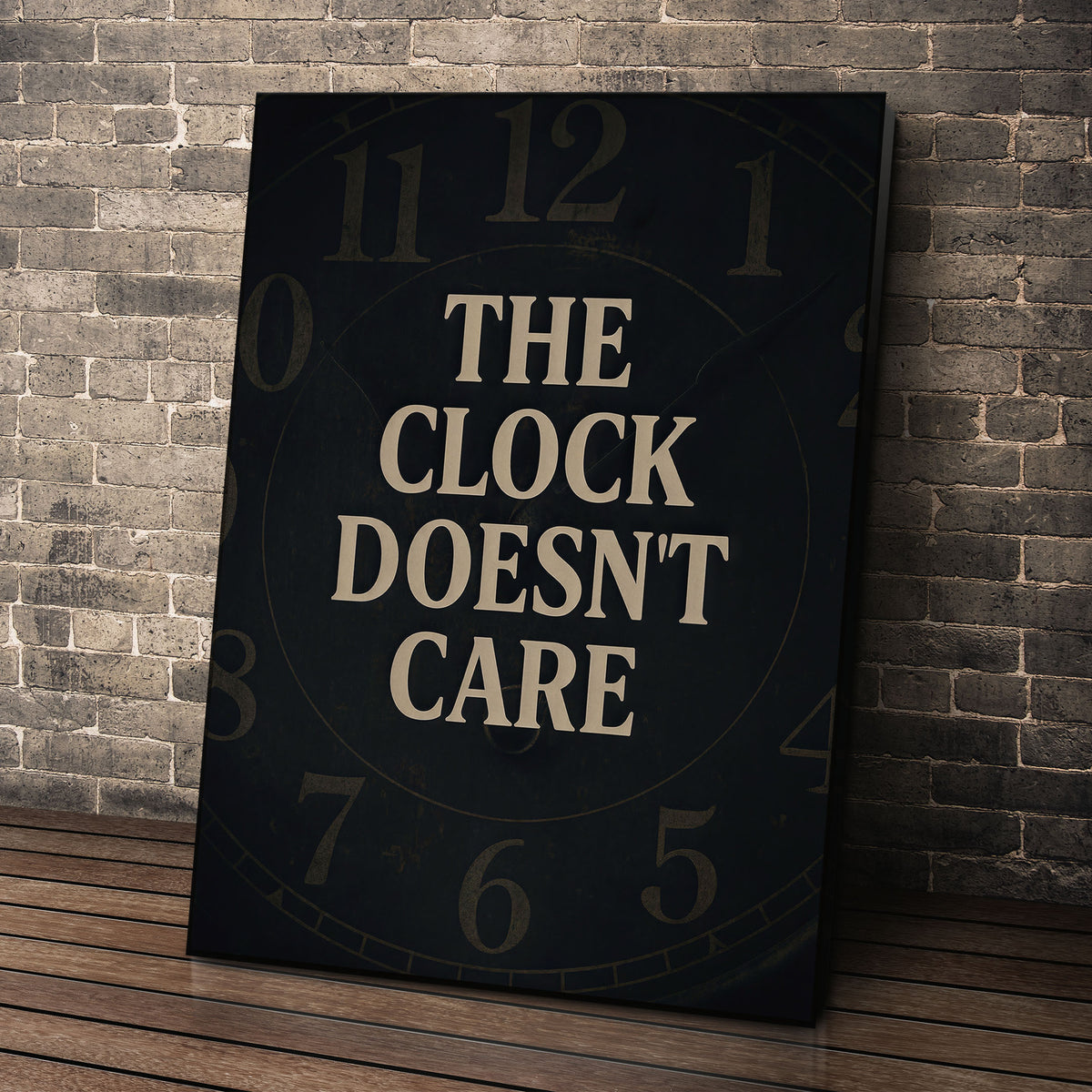 The Clock Doesn't Care wall art leaning against a brick wall