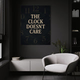 The Clock Doesn't Care wall art above a white chair in a dark room