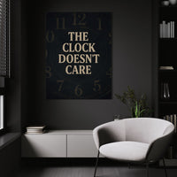 The Clock Doesn't Care wall art above a white chair in a dark room