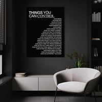 Things You Can Control (Black) wall art above a white chair in a dark room