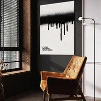 Until It Works wall art above a tan chair in a dark reading corner