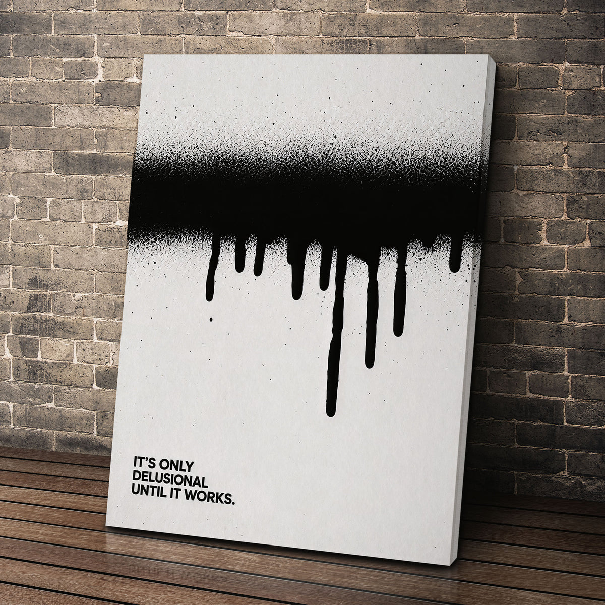 Until It Works canvas wall art leaning against a brick wall