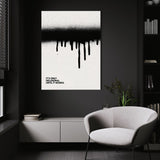 Until It Works wall art above a white chair in a dark room