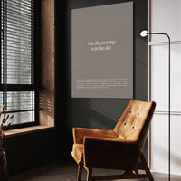 Win The Morning wall art above a wooden lounge chair in a dark room