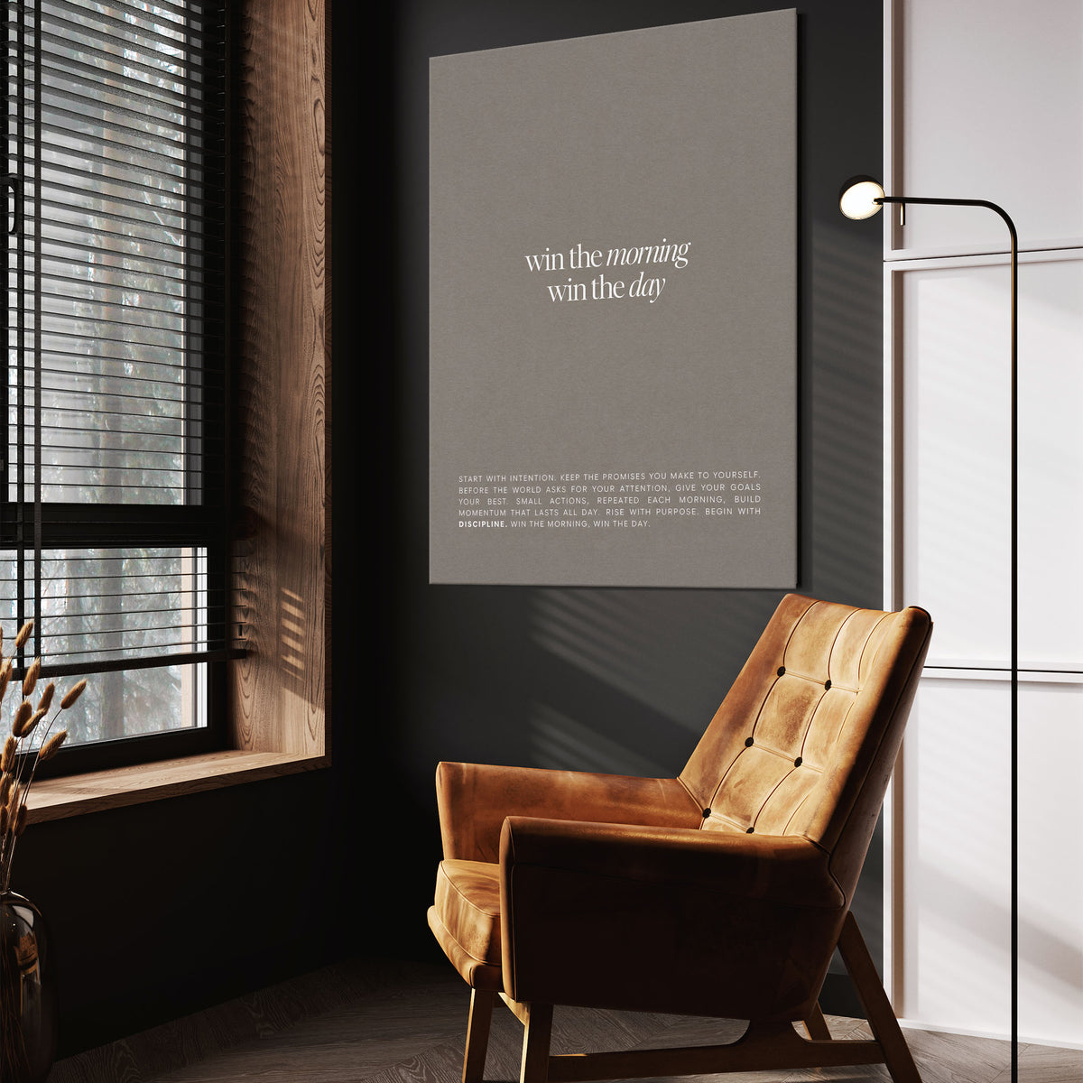 Win The Morning wall art above a wooden lounge chair in a dark room